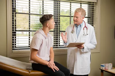 Young male receiving medical care through Covenant Home