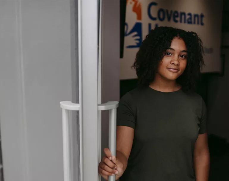 youth opening door to Covenant Home Maryland site