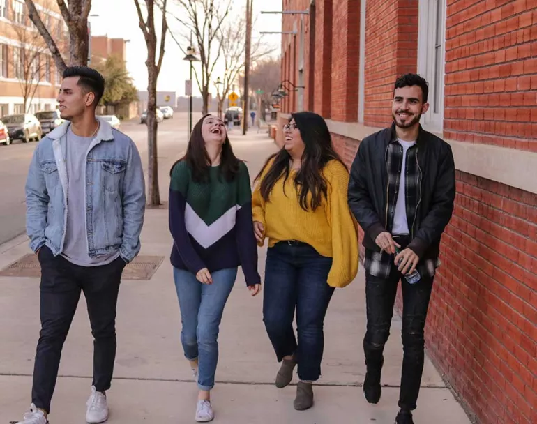 group of former homeless teens walking down sidewalk | Covenant Home - Get Involved