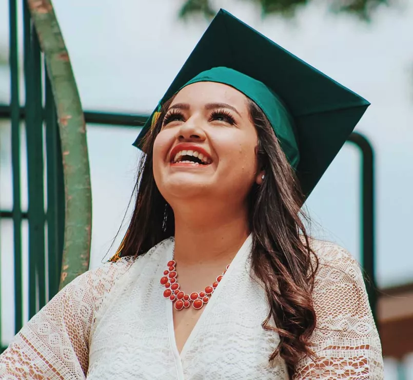 former homeless youth with graduation cap | Covenant Home education and workforce development