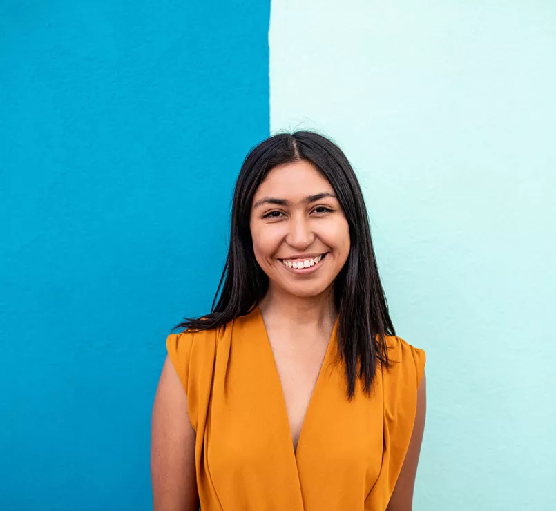 happy youth in front of two shaded blue wall | Covenant Home - Get Involved